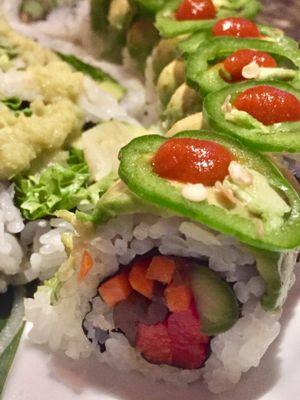 Garden Fire Roll: Fresh asparagus, kanpyo, carrots, red pepper, avocado, jalapeño and hot sauce at Sushi 101 Bar & Grill in Tempe