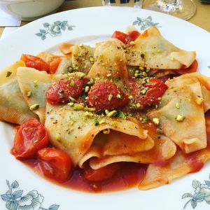 Vegan ravioli with cherry tomatoes and pistachio  at In Pasta in Lucca