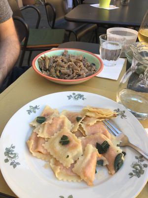 Pumpkin Ravioli with “butter” sage sauce and spelt pasta with porcini mushrooms sauce.  at In Pasta in Lucca