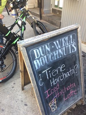 Street chalkboard at Dun-Well Doughnuts in New York City