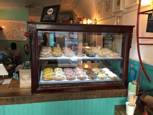 Case with donuts at Dun-Well Doughnuts in New York City