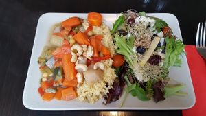 Dish of the day: quinoa with vegetables and salad with grapes and blueberries at De Plaats in Bruges