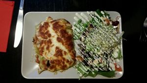 Lasagna with salad at De Plaats in Bruges