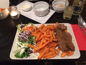 Vegan Flemish stew (vegan stoofvlees) with sweet potato fries at De Plaats in Bruges