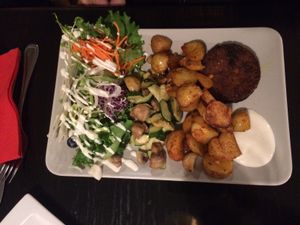 Vegan burger (inside was more like rice or something...) with delicious cajun potatoes and veggies at De Plaats in Bruges