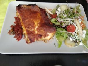 Vegetarian lasagna with salad at De Plaats in Bruges
