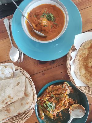 Delicious! Fried Aubergine in gravy sauce and a curry with naan bread at Govinda's Restaurant in Krabi