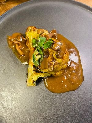 6-Course Vegan Thanksgiving. Brown Sugar Roasted Cauliflower
w/ mushroom gravy.
 at Cafe YOU in Cape Coral