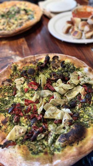 Pizza 1 with burnt tomatoe topping and dried out pesto  at Peekaboo Canyon Wood Fired Kitchen in Kanab