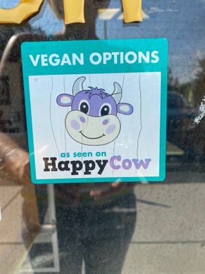 The happy cow sticker on the door! 💥  at Panda Chinese Restaurant in New Port Richey