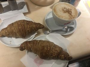 Pomegranate croissant and cappuccino  at Pasticceria Ponte delle Paste in Venice