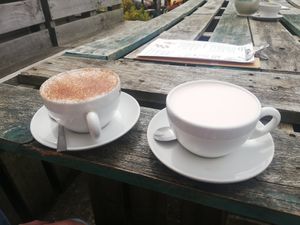 Pink latte with oat milk on the right at Wood and Green Cafe in Wadebridge