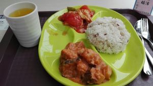 Eggplant and lotus in curry sauce, tofu skin in tomato sauce, five grains rice and fresh passion fruit juice.  at Vegether in New Territories
