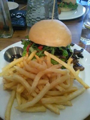 Yummy Mushroom Mafia burger with chips. at Duke's Burgers in Johannesburg
