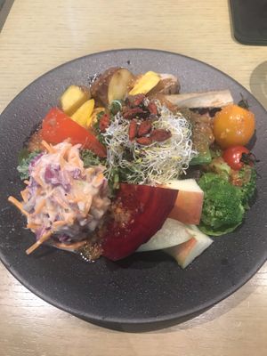 My third plate served by a staff at Cosme Kitchen Adaptation - Atre West in Tokyo