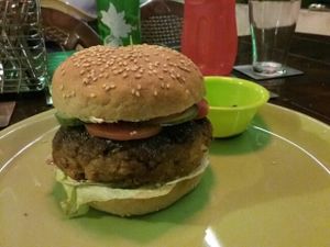 Vegan mushroom masala burger with vegan goat cheese ... yummmm at Veganza Cafe in Auroville