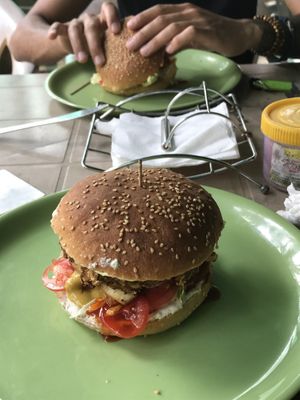 smoked tofu burg & the hummus burger  at Veganza Cafe in Auroville