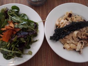 Pasta dish with creamy sauce and fake bacon bits. at Crazy Bean Cafe in Great Bookham