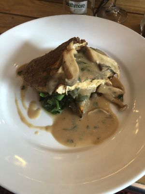 Tofu cutlet with spinach, potato and onion rosti and a creamy wild mushroom sauce at Crazy Bean Cafe in Great Bookham