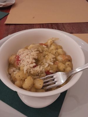 Vegan pesto gnocchi with cherry tomatoes at Origano Campo de' Fiori in Rome