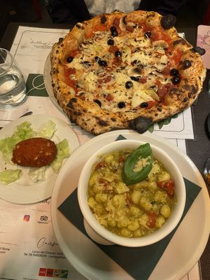 Pizza capricciosa! Gnocchi al pesto, suppli 😍 insanely goooood!! Vegan cheese yummy! And so many vegan desserts tooo!!  at Origano Campo de' Fiori in Rome