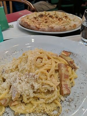 Front: vegan carbonara Back: plain focaccia at Origano Campo de' Fiori in Rome