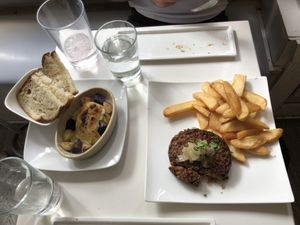 The divine roasted Brie (tapioca based), and the steak (three types of mushroom) frites, with truffle oil fries at Delice & Sarrasin in New York City