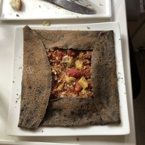 La Paysanne, savory buckwheat crêpe, with vegan bacon, potatoes, tomatoes and onions at Delice & Sarrasin in New York City