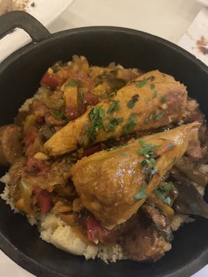 “Chicken legs” over couscous  at Delice & Sarrasin in New York City