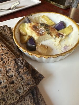 Melted and Roasted Brie (macadamia nuts based) served with baked potato, cooked with thyme and levain bread- the cheese is so good #Veganuary at Delice & Sarrasin in New York City