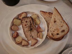 Roasted melted "brie" cheese cooked with thyme, served with potatoes at Delice & Sarrasin in New York City
