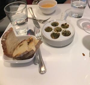 French cider and vegan ";snail "; dish  at Delice & Sarrasin in New York City