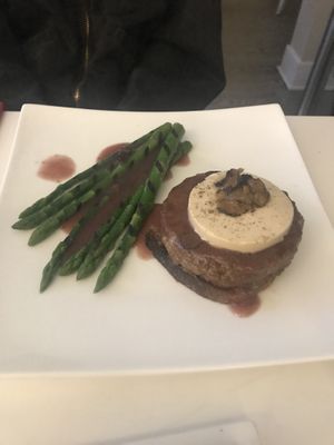 Impossible steak with foie gras on top of a crostini with a side of asparagus  at Delice & Sarrasin in New York City