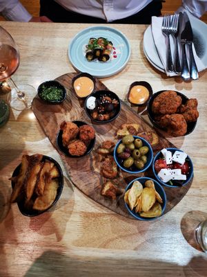 Sharing board, chips, cauliflower wings, aubergine harrisa rolls at The Allotment in Manchester