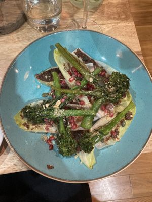 Broccoli and Chicory. Topped with olive tapenade, pomegranates and toasted hazelnuts  at The Allotment in Manchester