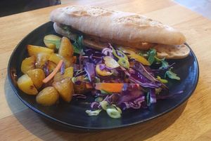 Bahn Mi Sandwich
-
Marinated tofu, pickled carrots & cucumber with fresh chilli, coriander & sriracha mayonnaise on a sourdough baguette, served with salt & pepper potatoes & Asian at The Allotment in Manchester