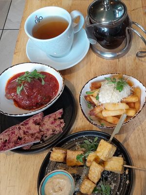 Garlic & truffle fries, soy balls in tomato sauce, tofu satay skewers at The Allotment in Manchester