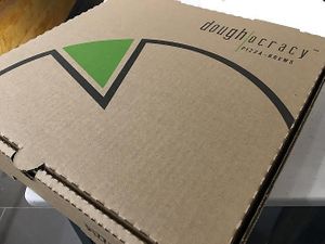 Pizza to go. Just like Grandma would want. at Doughocracy in Geneva