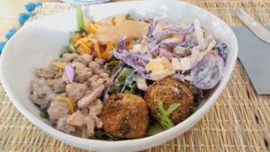 Lunch bowl with vegan haché, mushrooms bouchées, cabbage salad, pumpkin pasta at Joy Healthyfood in Montpellier