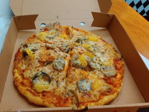 Sweet and spicy pizza with Vegan cheese at The Veggie Chippy in Birmingham