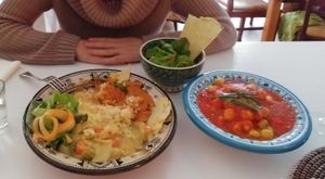 Gnochi con salsa casera de tomate, el bowl africano con cuscús, distintas salsas y verduras, ensalada y pan crujiente at ATAYA in Berlin
