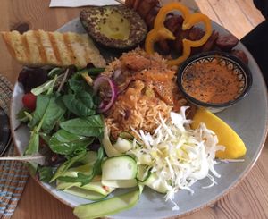 Fried plantain with jollof rice and salad at Ataya Caffe at ATAYA in Berlin