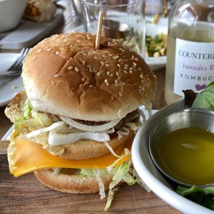 Big Maxine with a side of field greens    at Parlor City Vegan in Binghamton