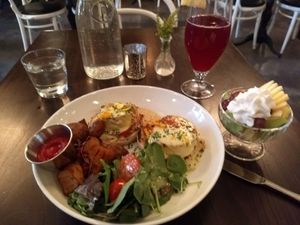 Tofu Benedict, side of fruit and kombucha at Modern Love in Brooklyn