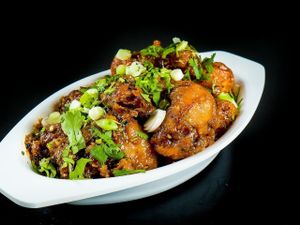 Gobi Manchurian indo-Chinese ( vegan ) 
cauliflower florets coated and deep fried for perfection and prepared variety of indo-Chinese sauce ,can be made dry or gravy  at Chowpatty Express in Katy
