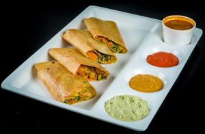 Creep Made of rice flour on grill with potato and vegetable stuffing served with 3 different dipping sauce  at Chowpatty Express in Katy