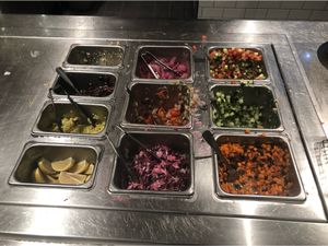 Diced vegetable toppings, carrots, cabbage, tomatoes, cucumber, peppers  at CAVA in Columbia