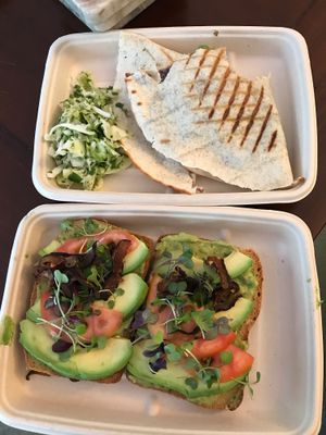Quesadilla with cilantro slaw and avocado toast with tomatoes and micro greens  at The Pureganic Cafe in Harrison