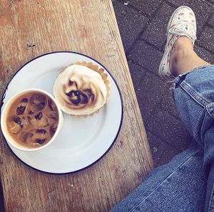 Vegan lemon meringue tart and iced coffee  at The Grand Howl in East London