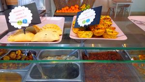 Labeled pastries (vegetarian) and main dishes below at O Canteiro in Setubal